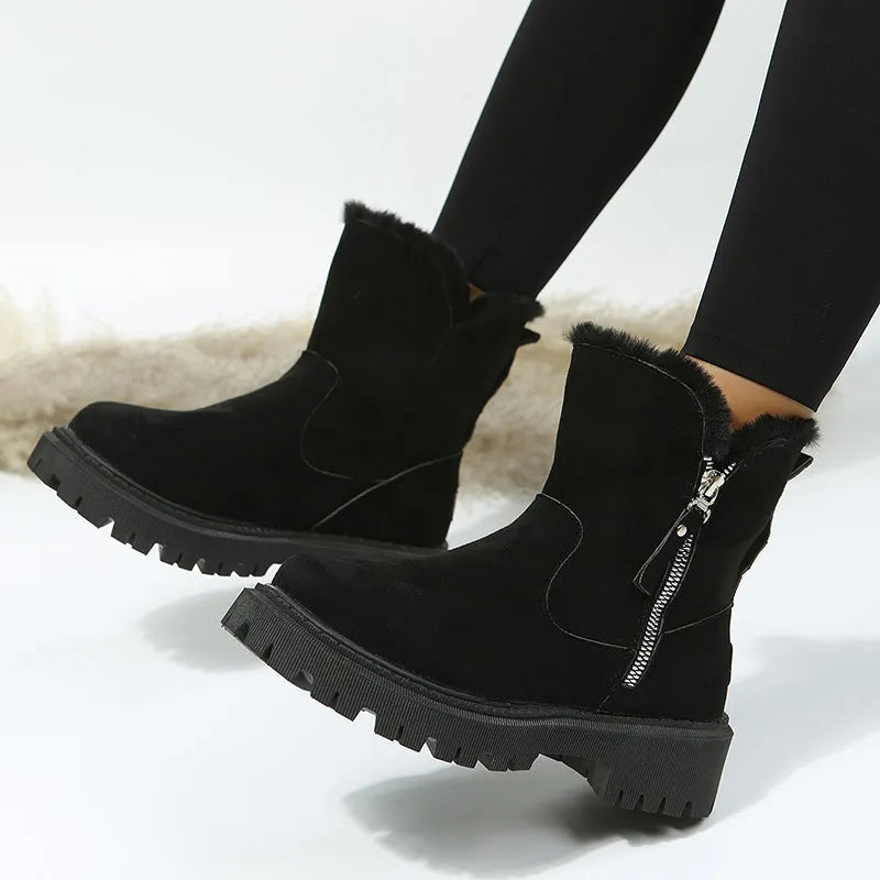 Women's black high-top snow boots with a side zipper and round toe on a non-slip rubber sole.