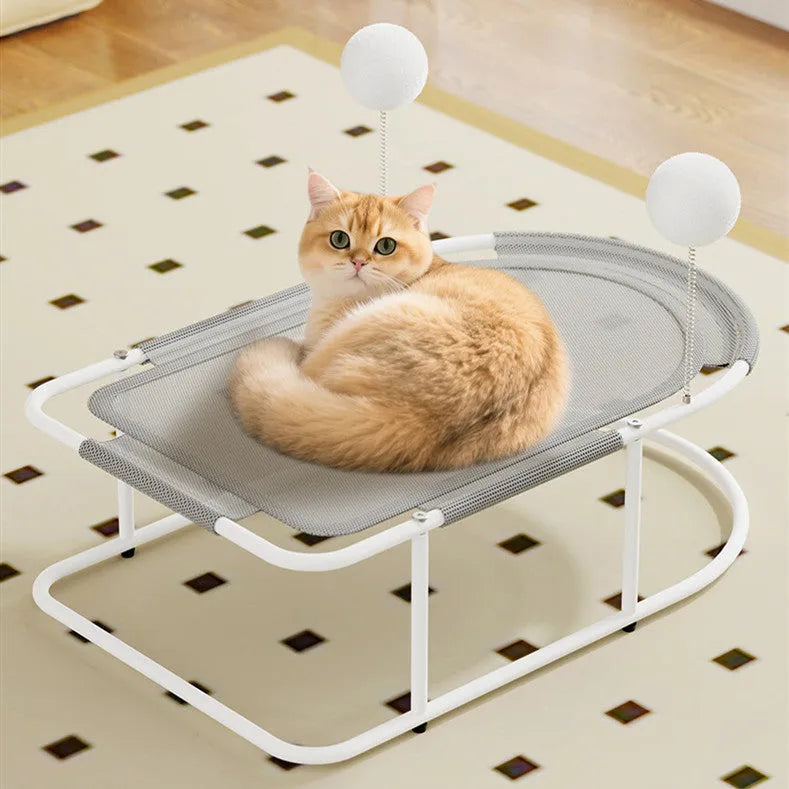 Grey fabric cat kennel with a metal bracket frame on a wooden floor.