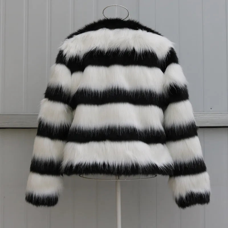 Women's black and white striped faux fur leather jacket with regular sleeves.