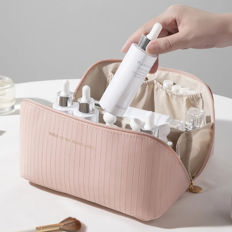 Vertical pattern pillow makeup bag in PU leather with cubic 22.5cm dimensions for travel storage