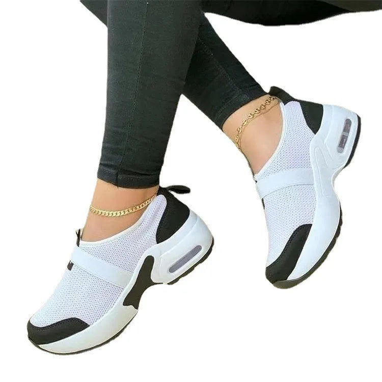 Women's lightweight flat sneakers with mesh upper, round toe, and rubber sole in multiple colour options.