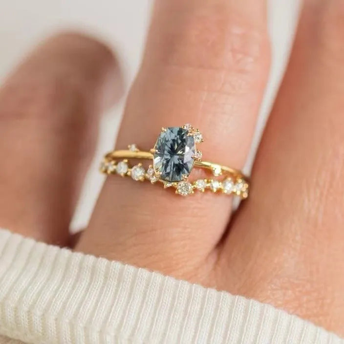 Gold-plated women's ring with green zircon floral design showing side profile