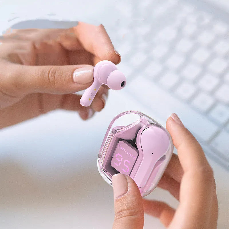 Mini wireless Bluetooth headset with LED power display, silicone case, earplugs, and USB-C charging cable on a grey background.