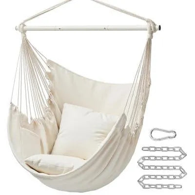 Folding canvas hammock in beige with seat cushion and three-section iron pipe on a garden background