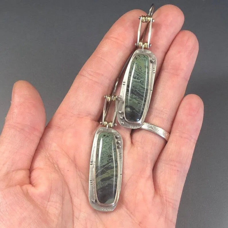 Geometric drop earrings with a two-tone marble pattern finish, made from silver-toned alloy.