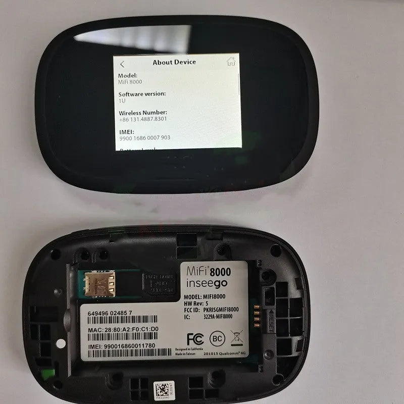 Black mifi8000 4G portable wireless router showing its compact size next to a data cable.