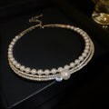 Silver curved geometric clavicle chain necklace for women highlighting the collarbone.