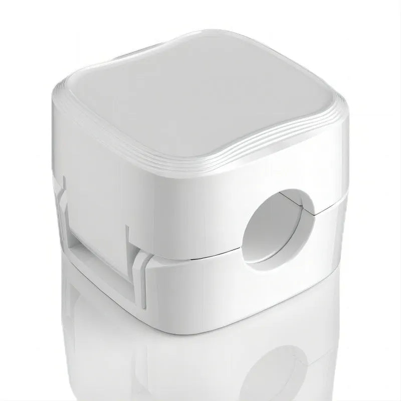 White and black magnetic under-desk cable clips organising various cables with adhesive backing