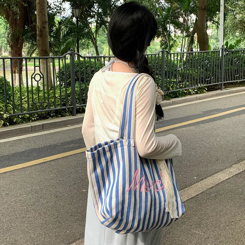 Blue striped letters printed cotton canvas bag in pink, blue and white stripes.