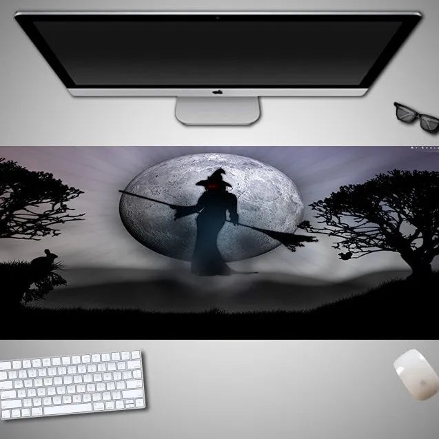 Oversized Halloween pattern rubber cloth mouse pad on a desk with non-slip base.