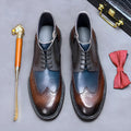 Men's curry blue leather brogue ankle boots with vintage carved stitching and front lacing.