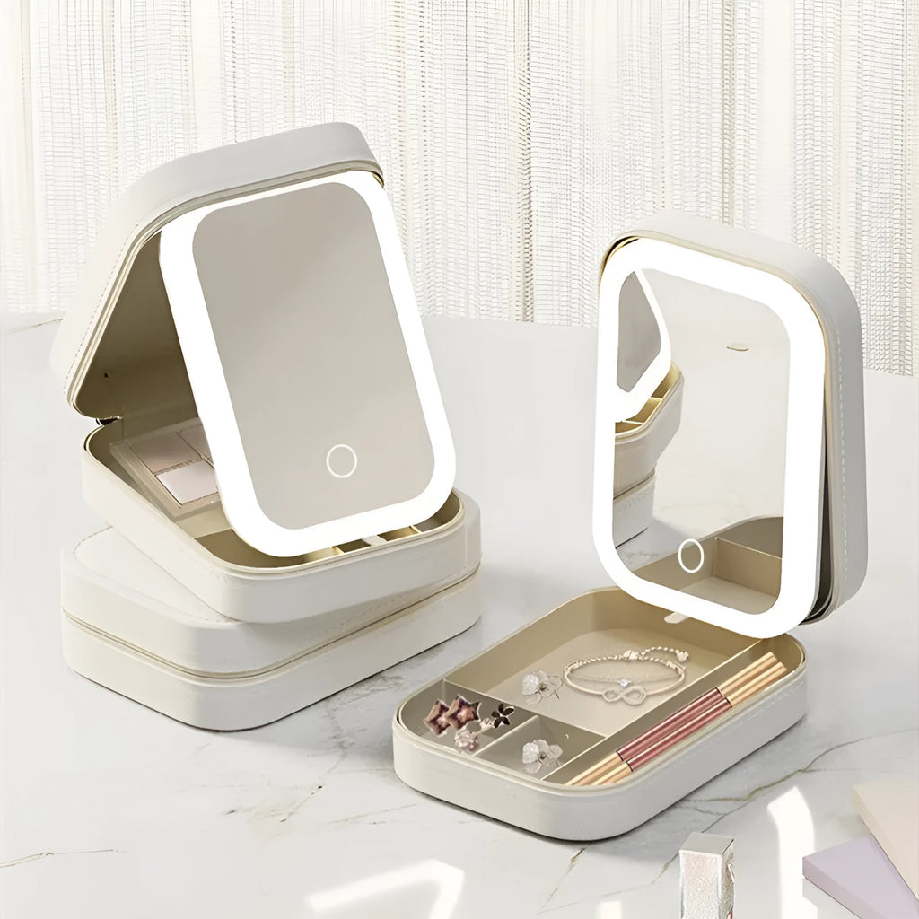 Portable LED light makeup mirror with open storage box in Cherry Blossom Pink.