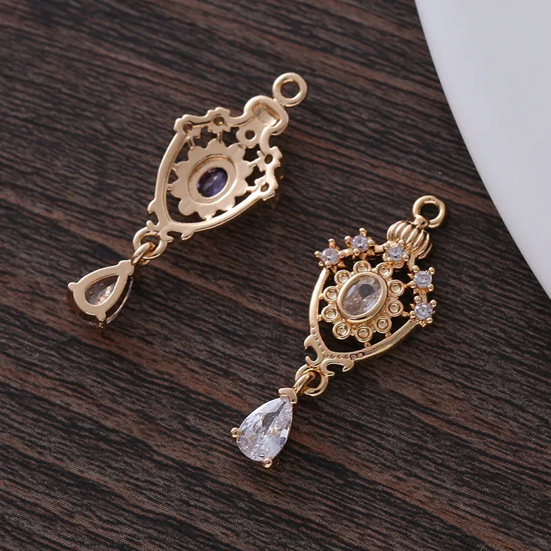 Micro inlaid zircon crown hollow water drop pendant in electroplated copper measuring 12x23mm