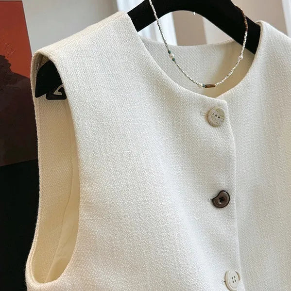 Women's beige round neck sleeveless bandage vest, French style, on a hanger.