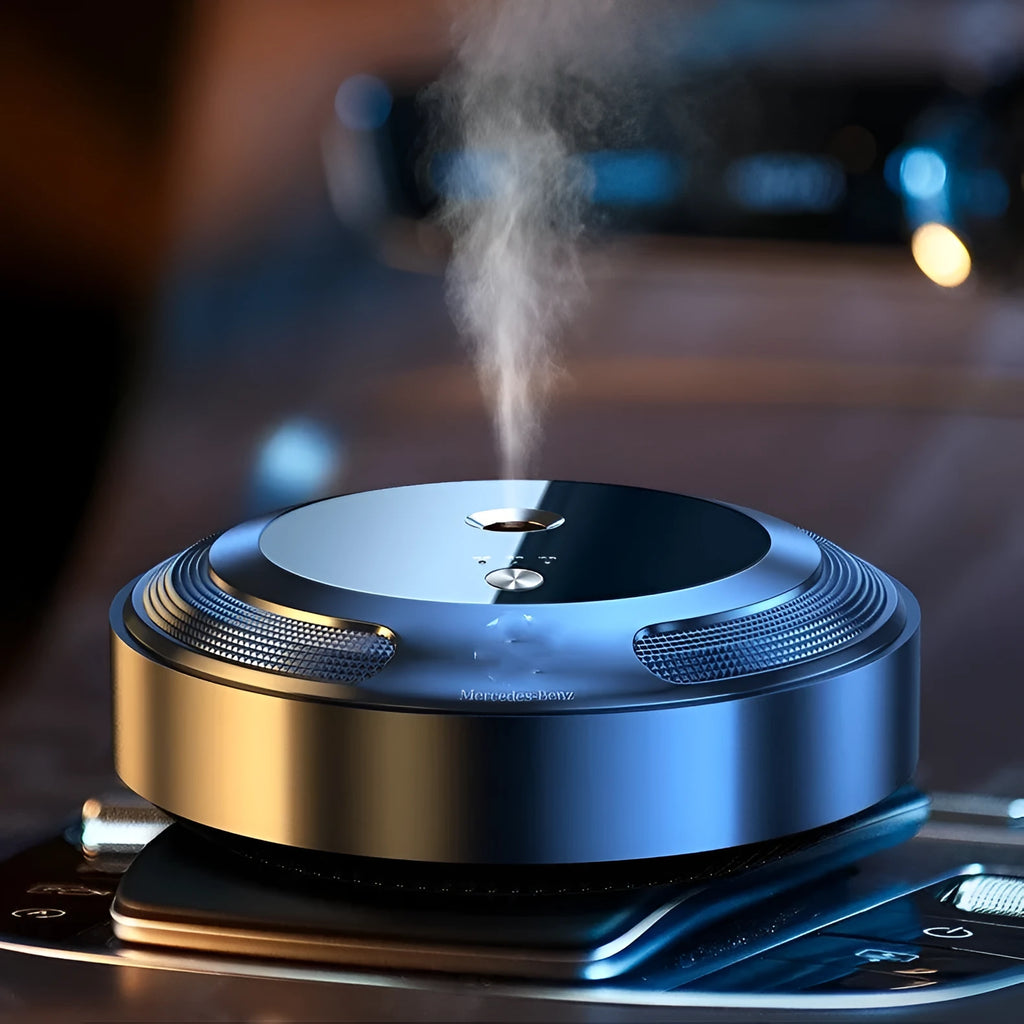 Automatic car air freshener diffuser with zinc alloy shell and included fragrance bottles on a dashboard.