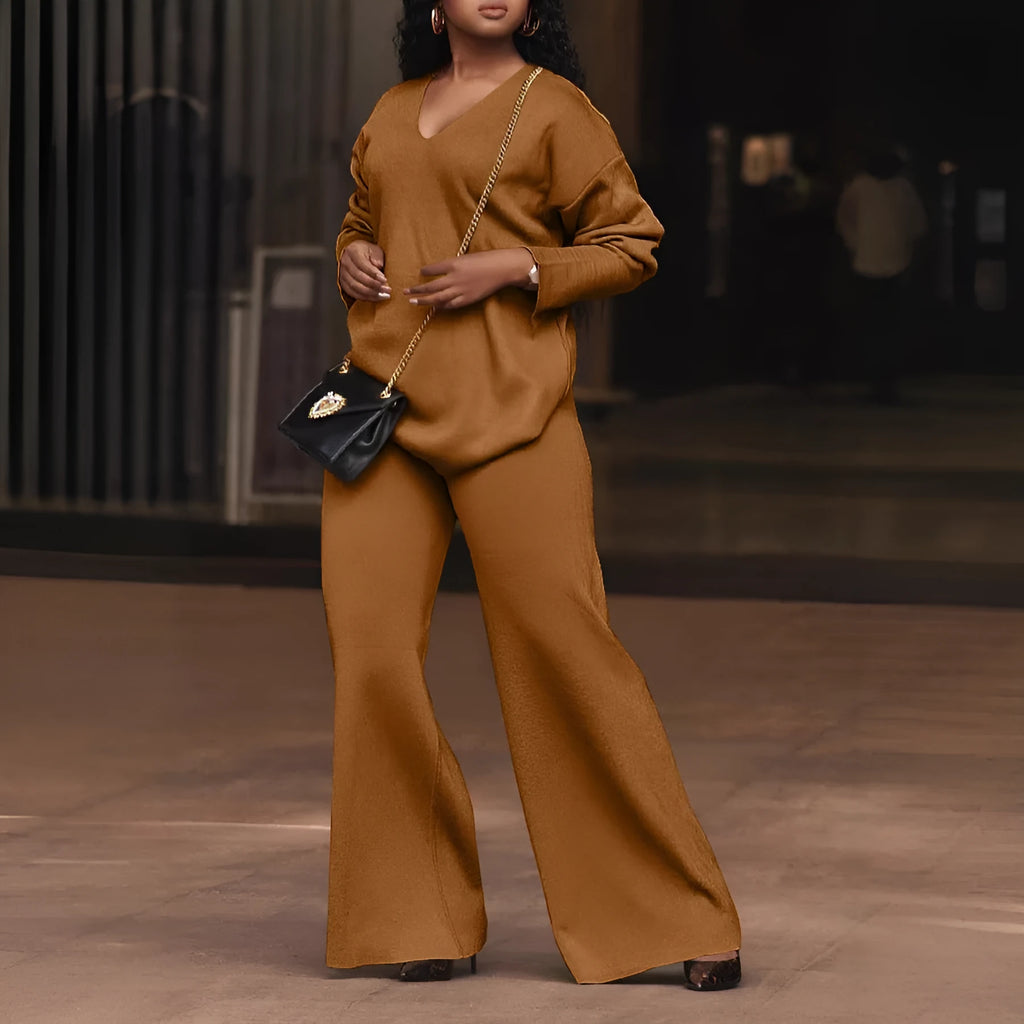 Women's brown thick suede two-piece suit with long sleeves and trousers, laid flat.