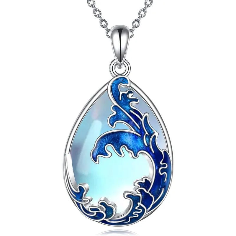 Moonstone blue heart-shaped alloy pendant on a women's necklace.