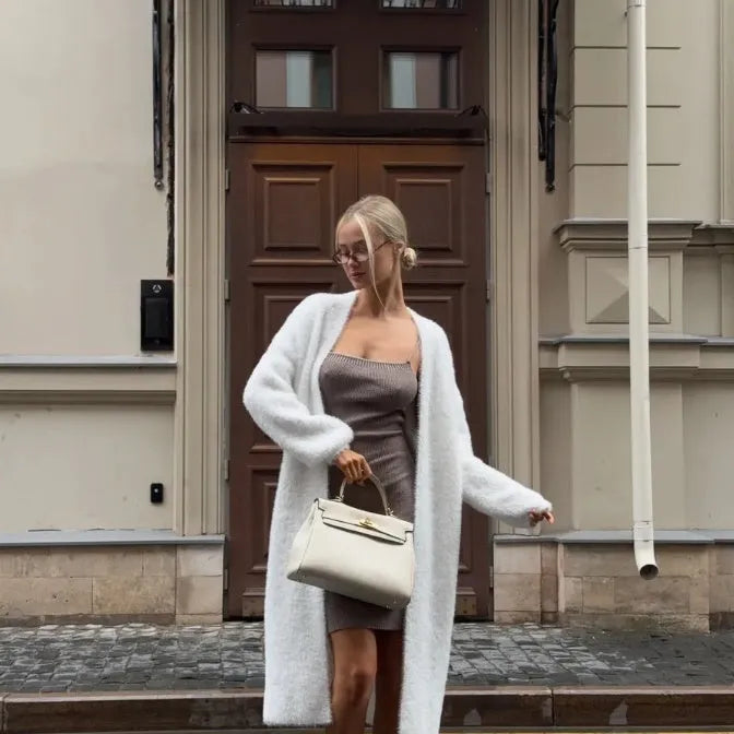 White women's cardigan sweater jacket with extended length and loose fit