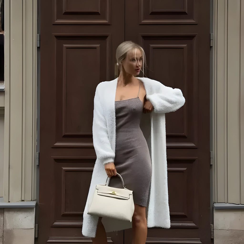 White women's cardigan sweater jacket with extended length and loose fit