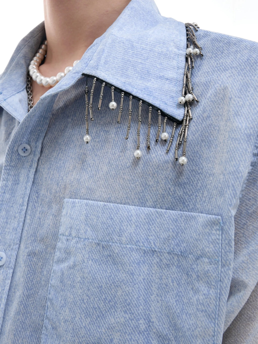 A blue and white gradient loose short-sleeve shirt on a hanger.