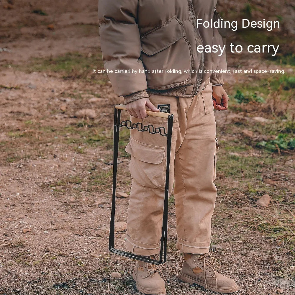 Folding outdoor rubbish rack with iron frame and wooden handle, shown in black colour.