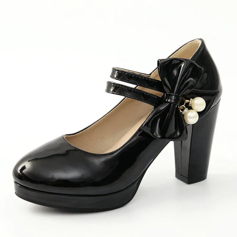 Red waterproof platform shoes with a thick chunky heel, round toe, and buckle fastening on the side.