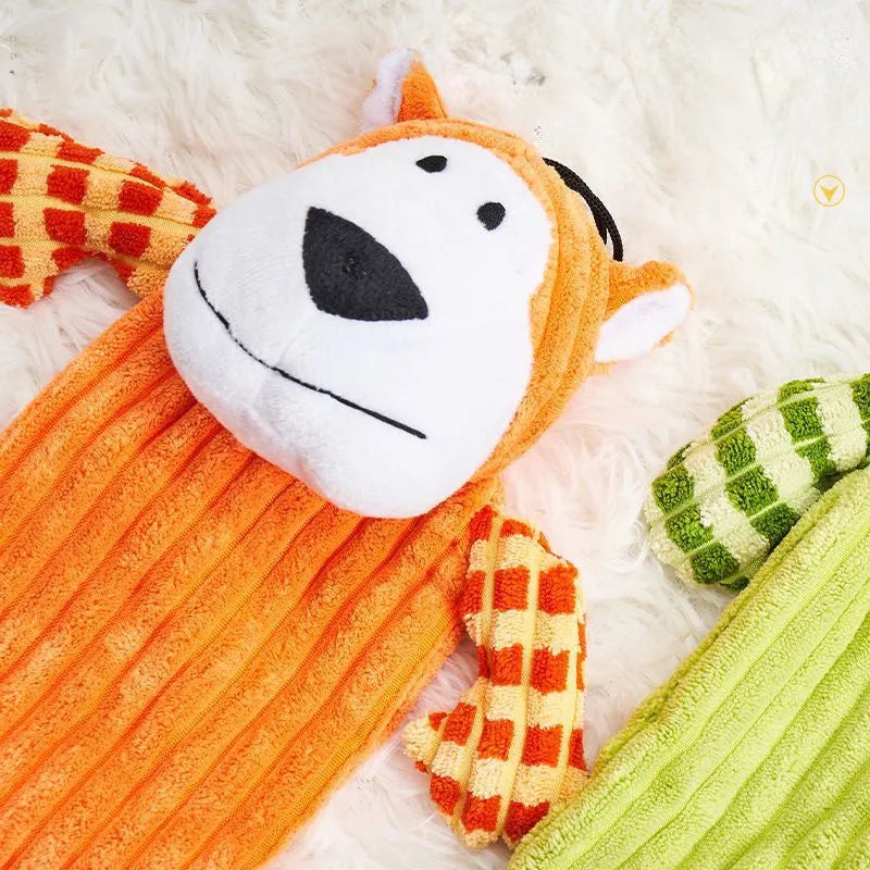 Orange and green plush dog toy with squeaker for aggressive chewers