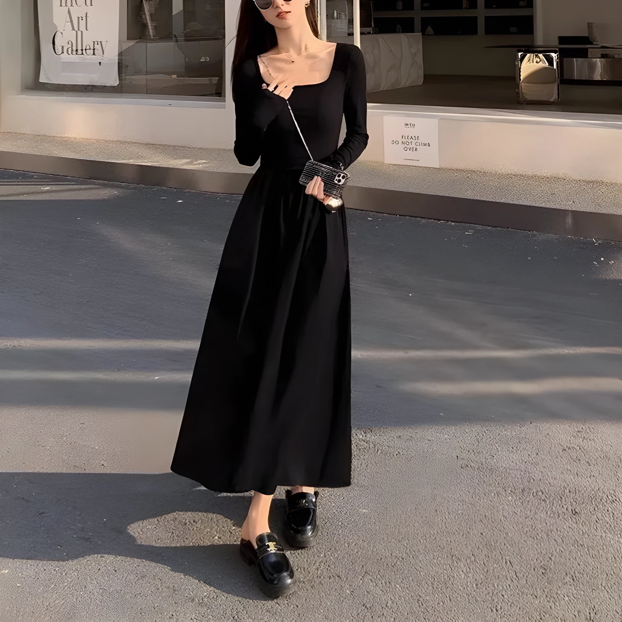 Women's black square collar knitted dress with long sleeves and an elastic A-line waist