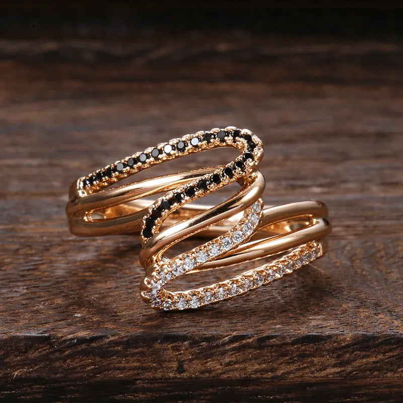 Close-up of a women's copper ring with micro-inlaid zircon stones and an electroplated finish.