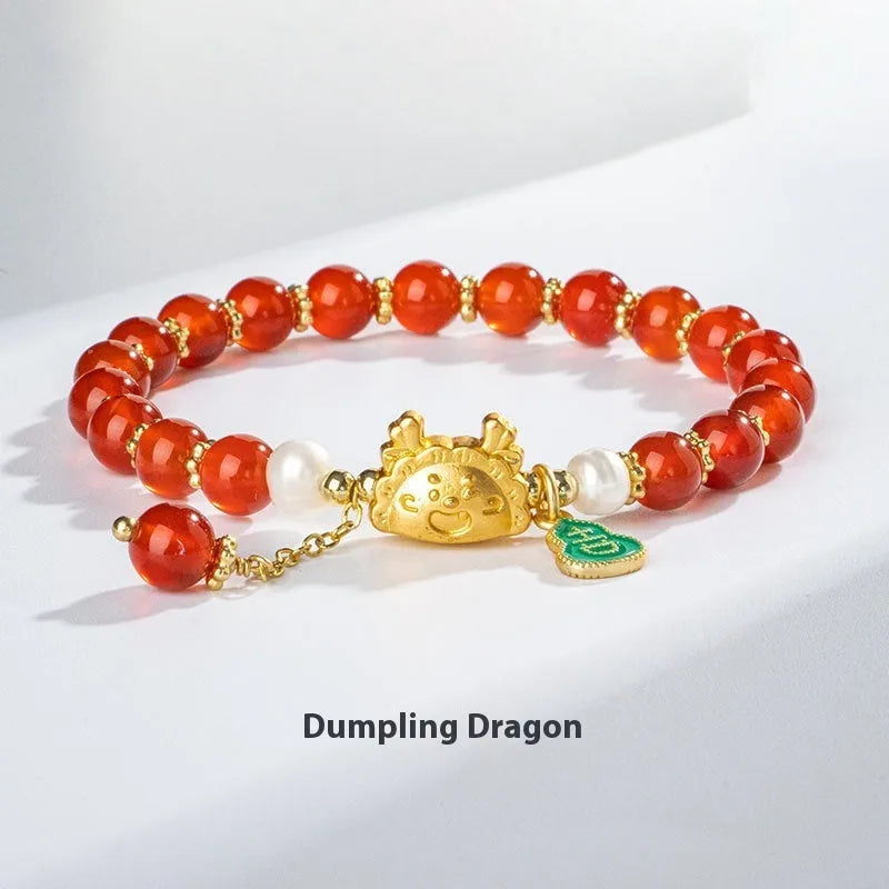 Natural agate bracelet with diamond-shaped beads and a dragon zodiac charm on a wrist.