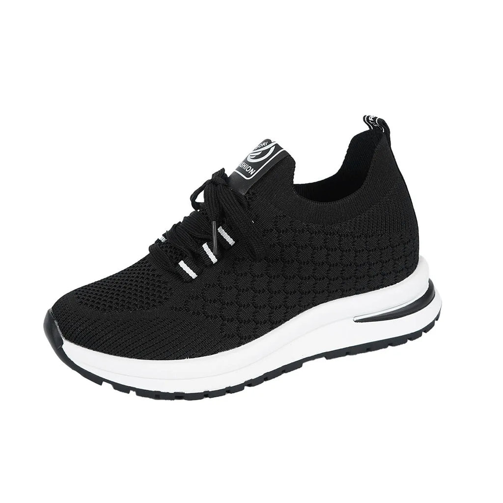 Women's black mesh lace-up flat platform sneaker on a white background