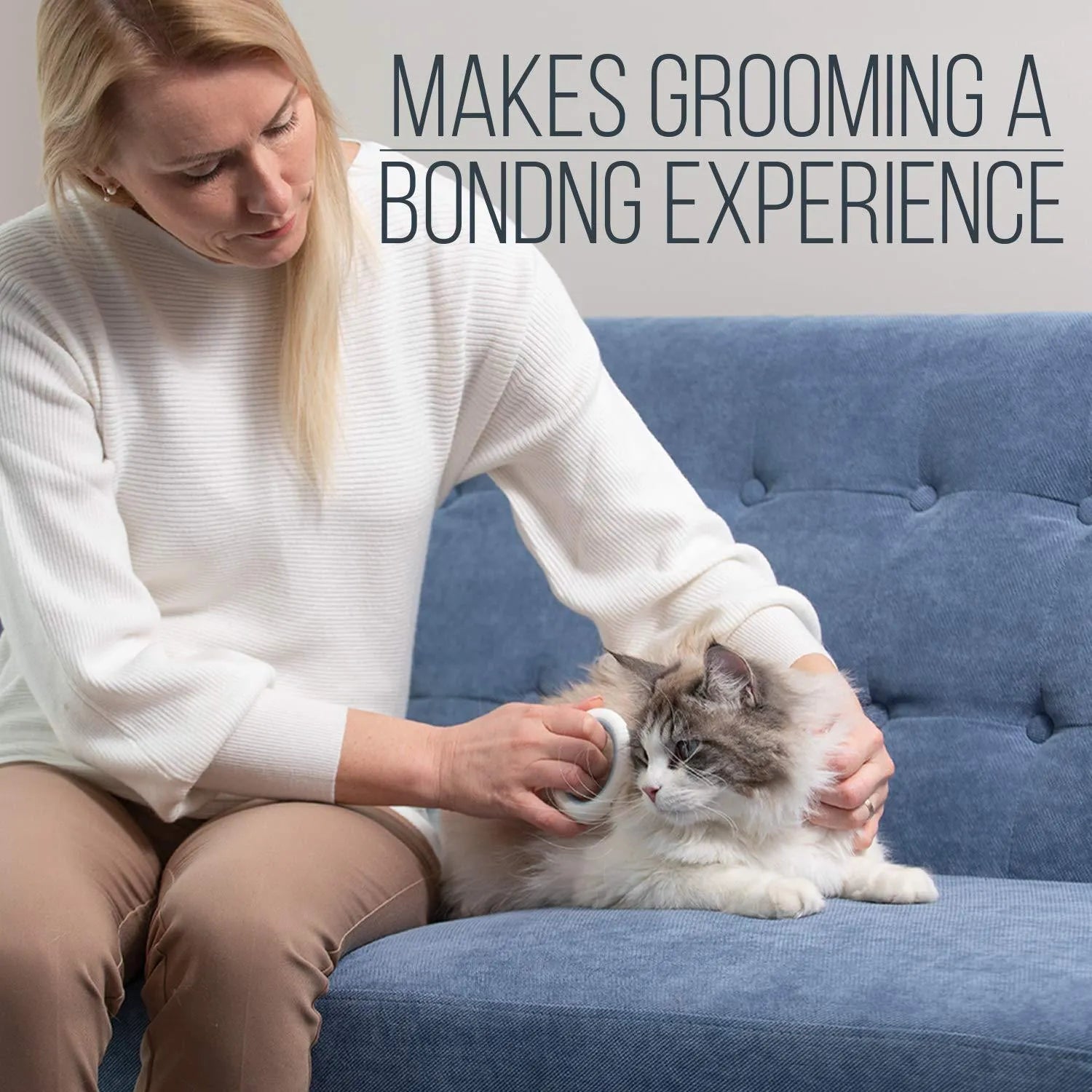 Blue pet grooming comb with ergonomic handle and soft teeth for cats and dogs on a white background.