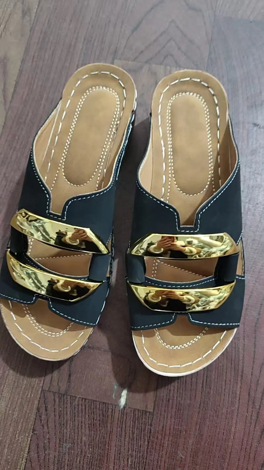Roman style platform flip-flop sandals in a solid colour with a flat heel and metal detail.