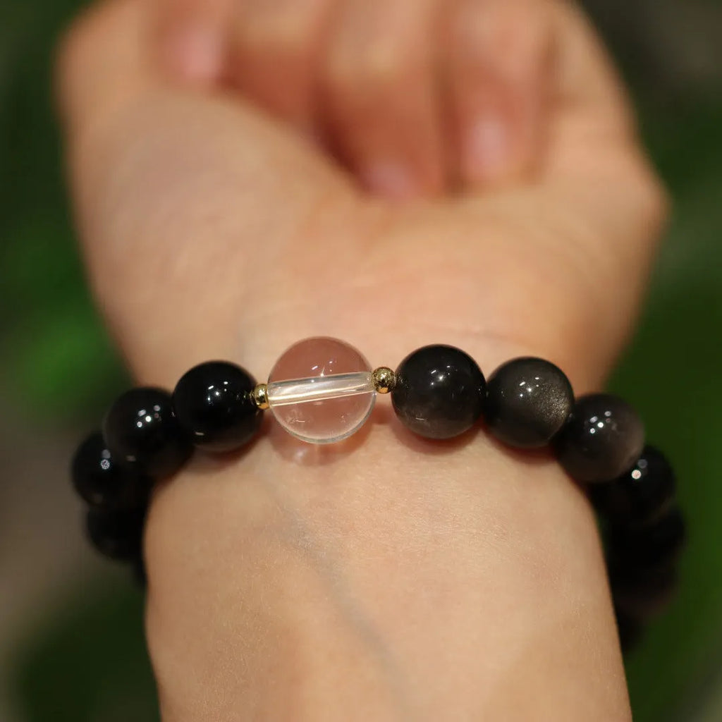 White crystal and cat eye obsidian geometric bracelet with Chinese auspicious patterns