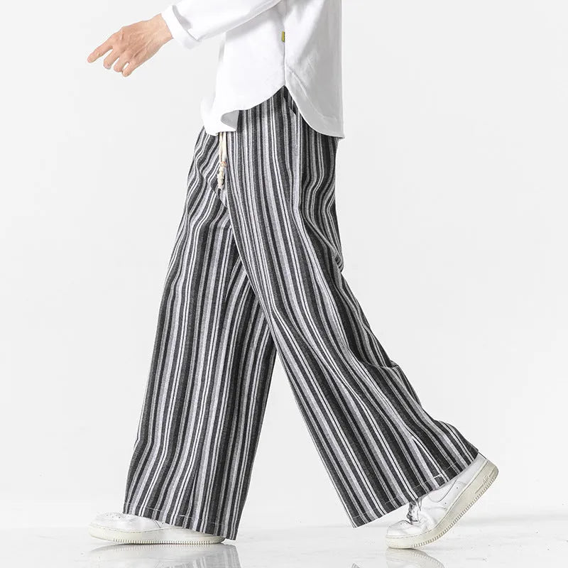Man wearing vintage stripe loose straight leg cotton blend mopping pants in khaki colour.