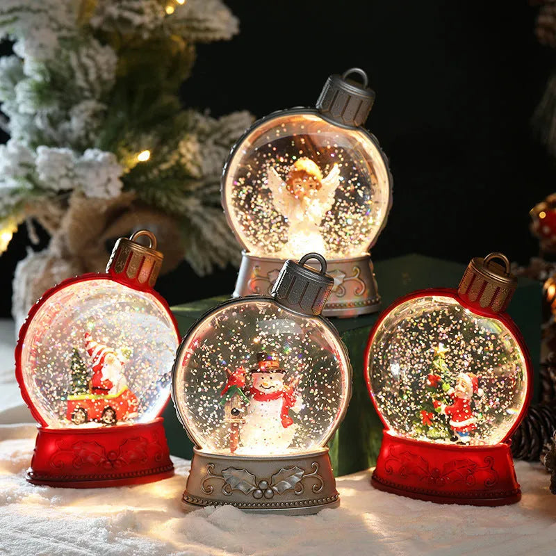 Set of four battery-powered LED Christmas decoration figures including old man, snowman, child tree and angel