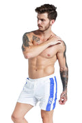 Blue men's slim-fit sports shorts with a lace-up front waistband on a plain background.