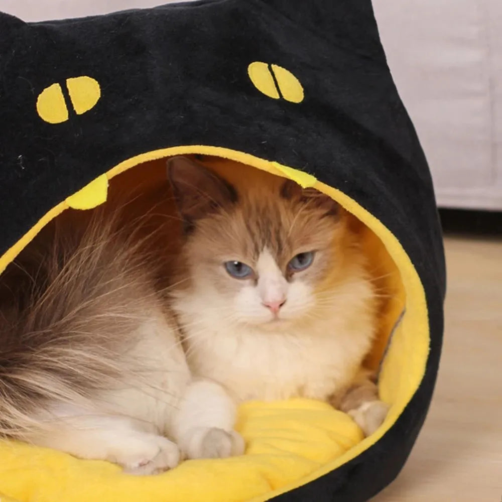 Soft plush covered cat cave bed with anti-slip bottom for cats and small dogs.