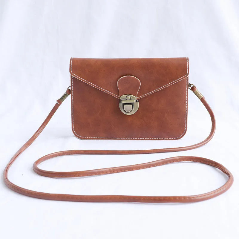Retro soft surface messenger bag with lock closure showing wine red colour option