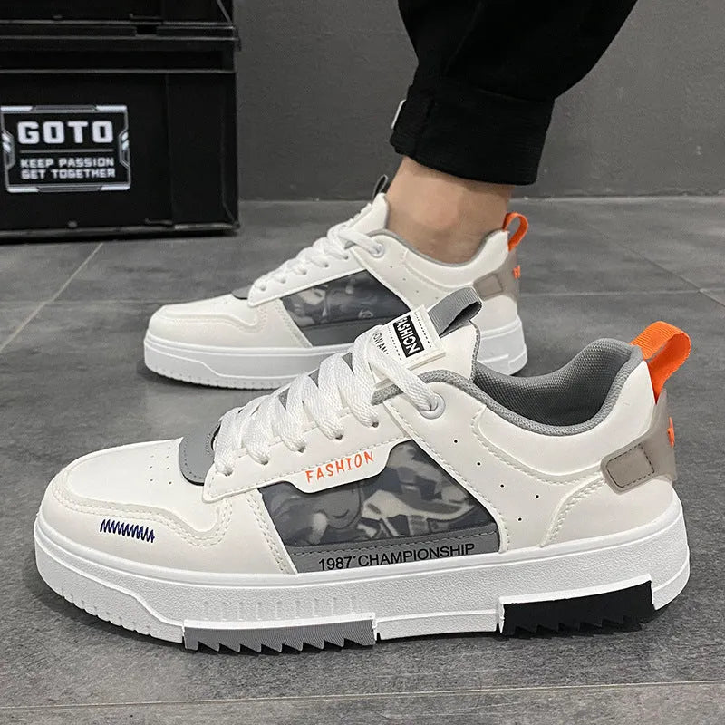 Men's white casual sneakers with lace-up front, low heel, and mesh lining, side view.