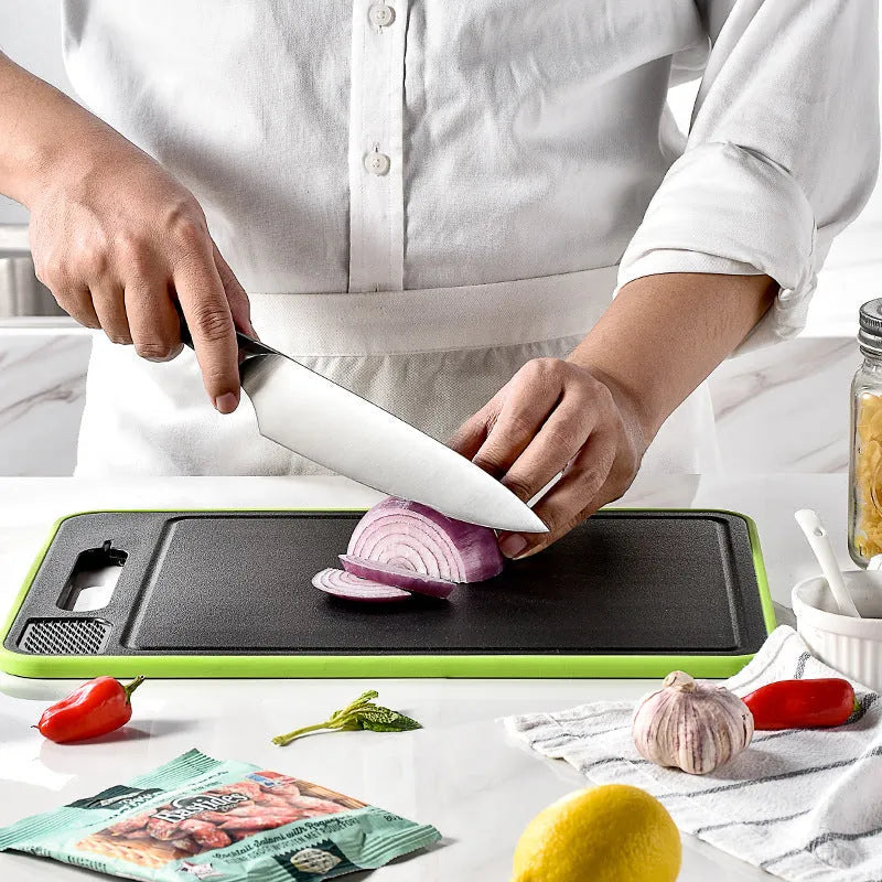 Square grey aluminium cutting board with double-sided design showing grinding teeth and integrated knife sharpener
