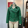 Black punk-style leather jacket with a Peter Pan collar, short belt on lapel, and a drawstring waist.