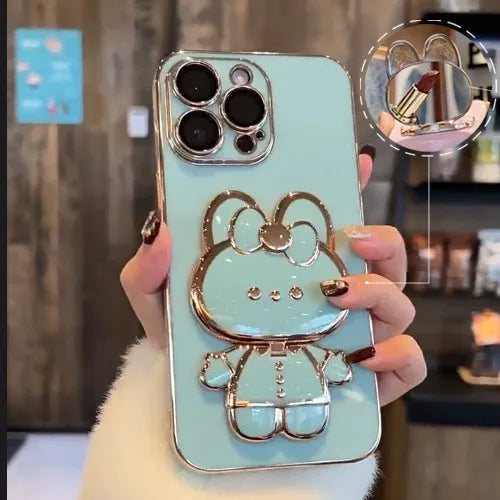 Cartoon rabbit stand mirror iPhone case in TPU with electroplated 3D design and anti-fall protection.