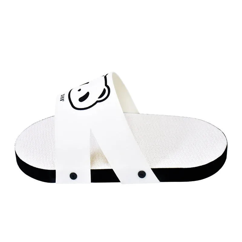 White corrugated paper cat scratch board in a slipper style design on a floor.