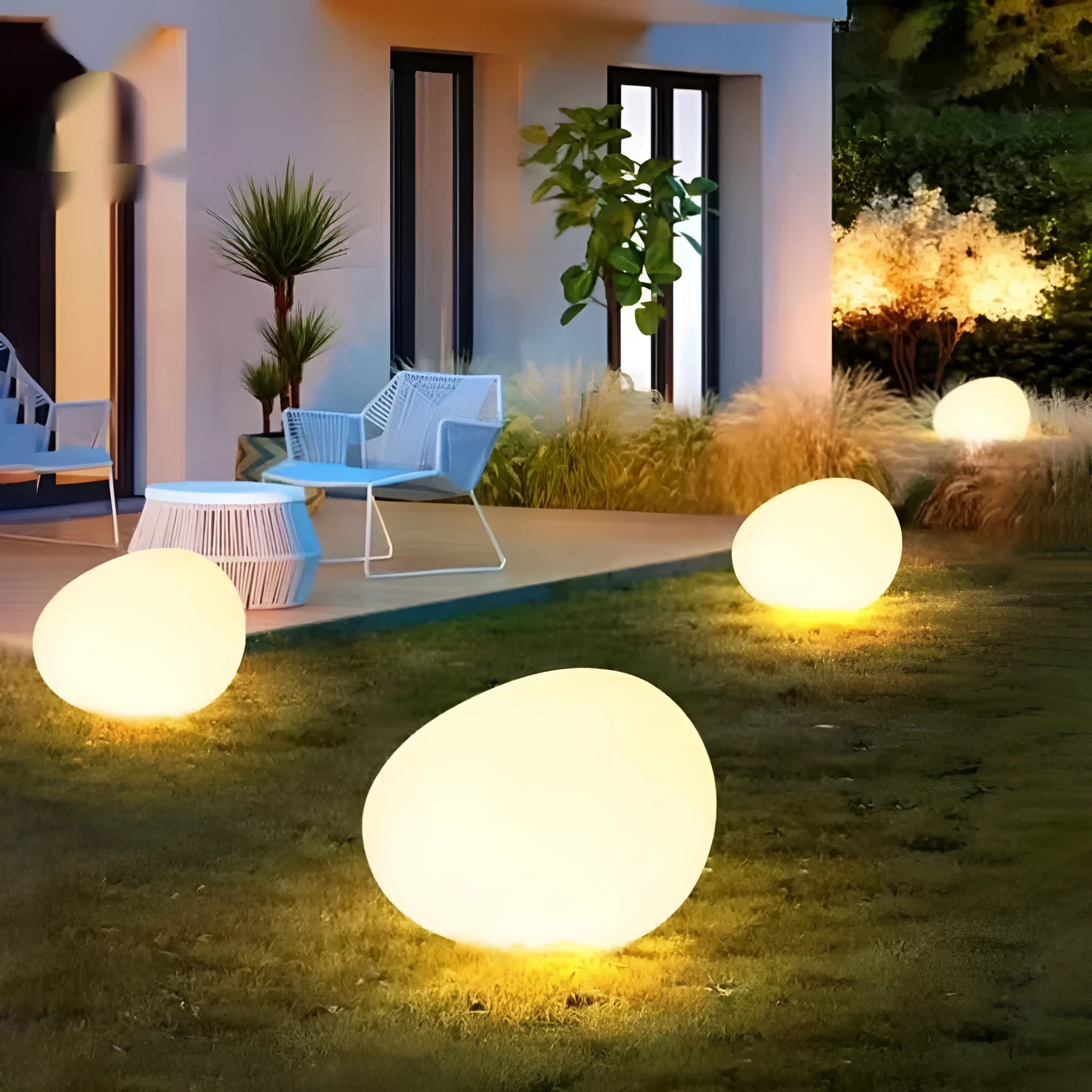 Outdoor pebble light in stone shape with IP65 waterproof rating, available in 26-48cm sizes for garden path, solar or rechargeable power options