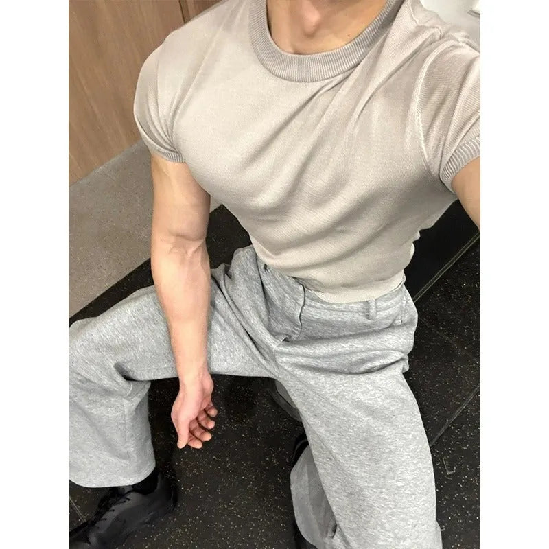 Men's slim fit short sleeve polyester T-shirt showing cuff-closing thread detail in solid colour option.