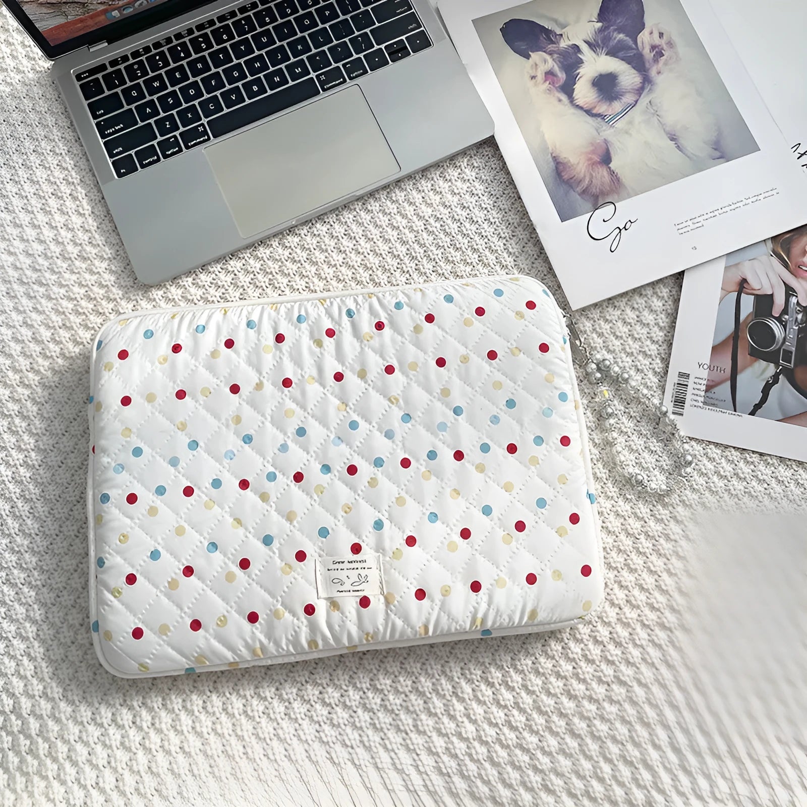 Women's polka dot polyester laptop bag showing three size options