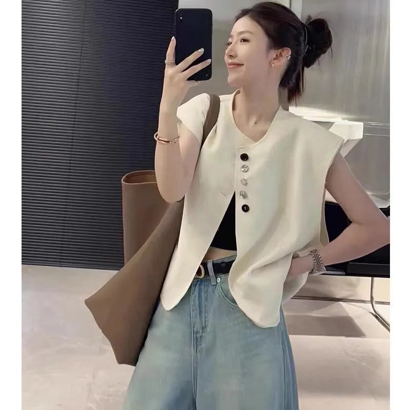 Women's beige loose-fit polyester vest with a pocket, shown on a hanger.