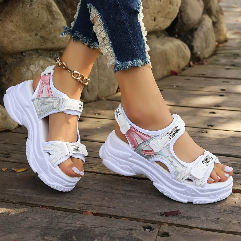 Women's black Roman platform sandals with adjustable straps and rubber soles