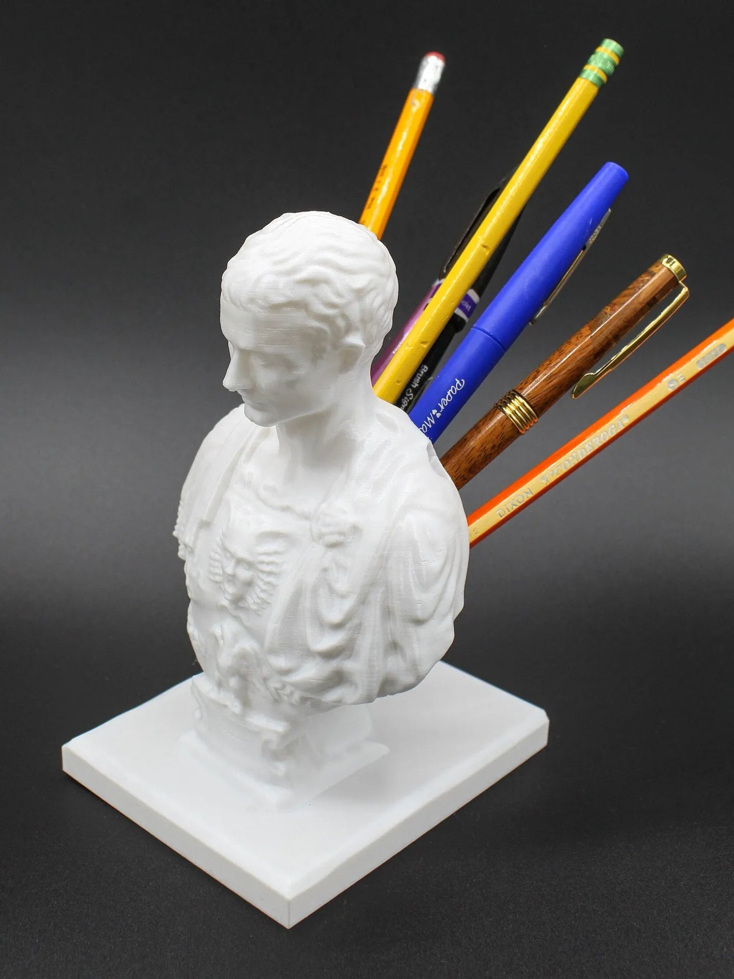 White American creative character modelling synthetic resin pen holder on a desk.